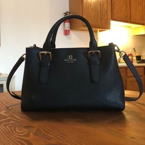Black Kate Spade handbag with shoulder strap